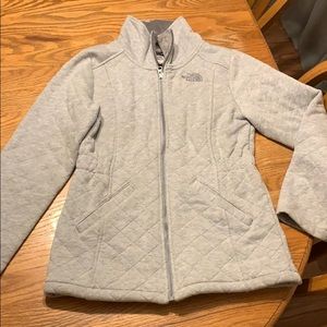 North face jacket worn a hand full of time